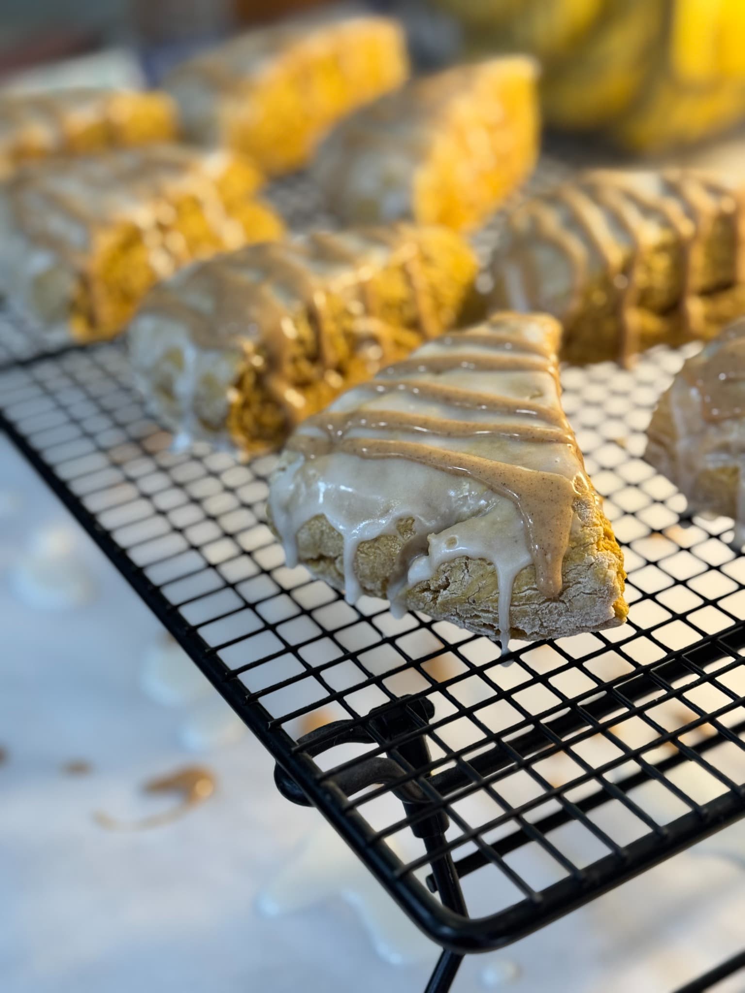 Fresh pumpkin scones with vanilla glaze and pumpkin spice drizzle