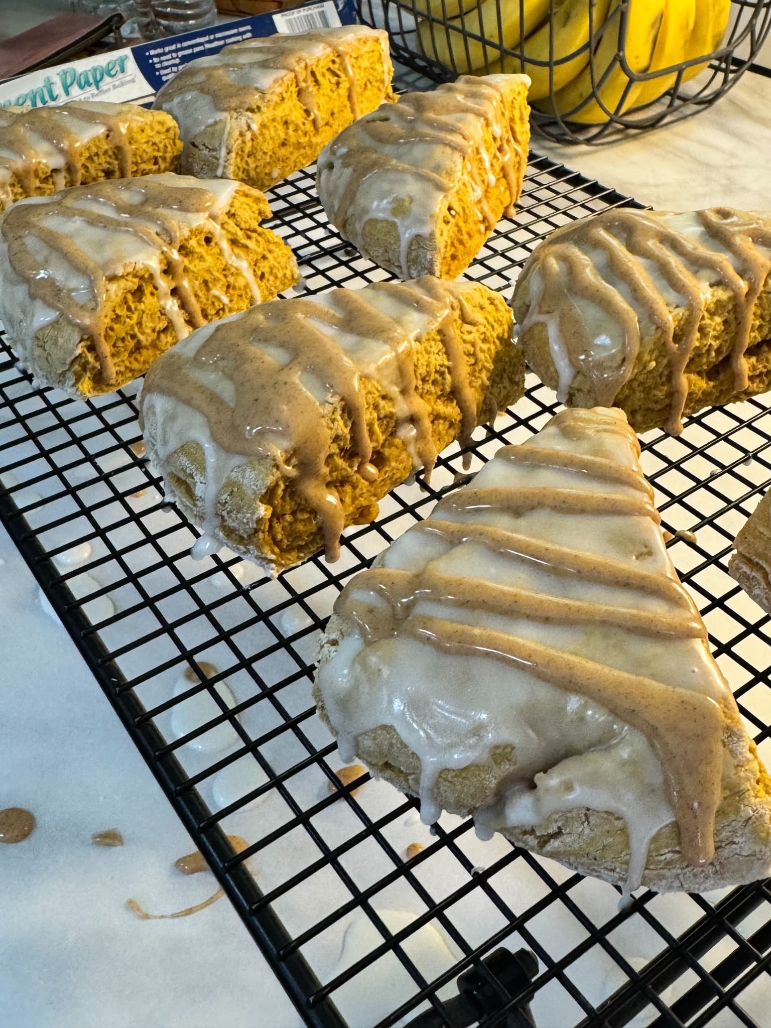 Batch of pumpkin scones cooling after glazing
